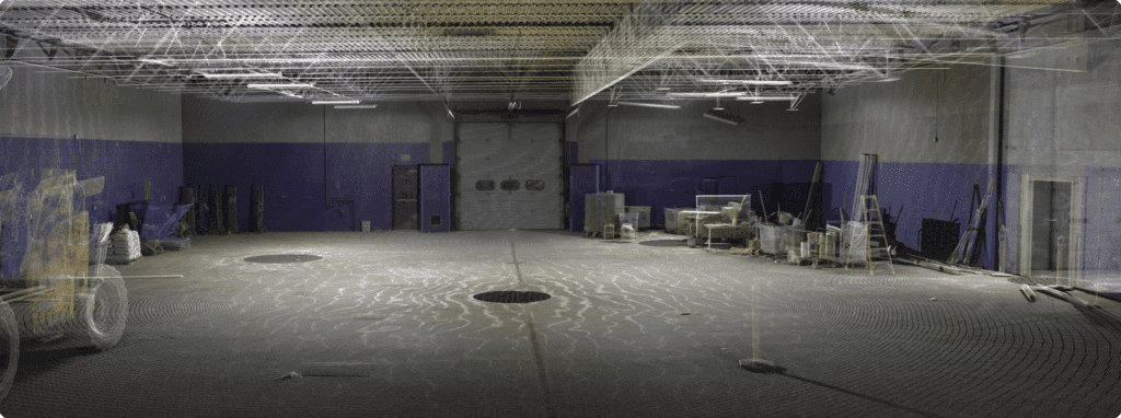 Photorealistic point-cloud scan of Mint Gaming interior showing ceiling trusses, support columns and floor.